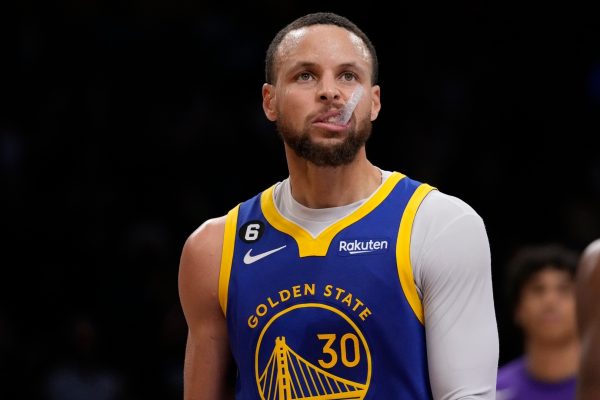 Golden State Warriors guard Stephen Curry stands on the court in at the closing minutes of a loss to the Los Angeles Lakers during the second half in Game 6 of an NBA basketball Western Conference semifinal series Friday, May 12, 2023, in Los Angeles. (AP Photo/Ashley Landis)